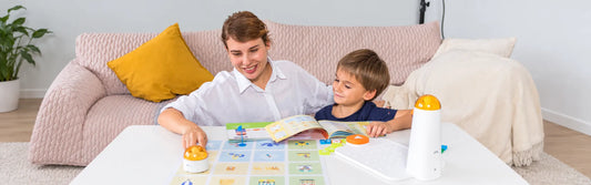 Adult and child using a screen-free coding robot for home with an activity guide